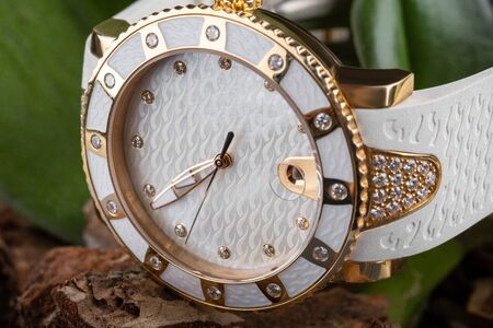 Women's white watch with white dial, leather strap with rhinestones.の写真素材