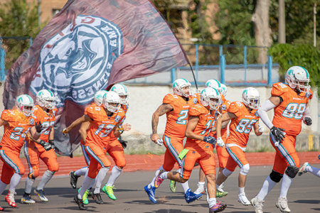 Start of the american football game. show with fire. teams entering the stadium. american football competitions Stallions Kyiv - Hurricanes Minsk 08.09.2019のeditorial素材