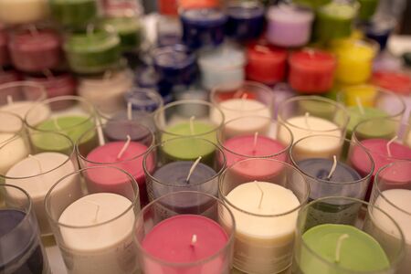 Candles background. Multicolored candles. Aroma candles on the storeの写真素材