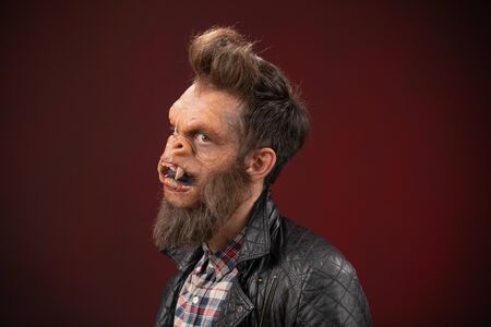 Portrait of Monkey man. Monkey man cinematic make-up for horror movie or Halloween.