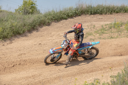 Ukraine, Kyiv, 06.06.2020. First step Golosievo-MX Pyrohiv-Kyiv Extreme Motocross MX Rider riding on dirt track. athletes children, juniors, men, womenのeditorial素材