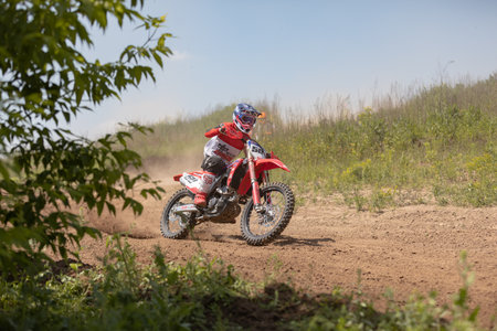Ukraine, Kyiv, 06.06.2020. First step Golosievo-MX Pyrohiv-Kyiv Extreme Motocross MX Rider riding on dirt track. athletes children, juniors, men, womenのeditorial素材