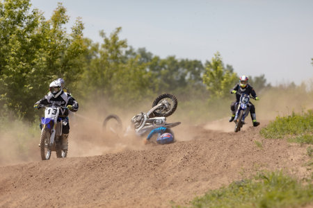 Ukraine, Kyiv, 06.06.2020. First step Golosievo-MX Pyrohiv-Kyiv Extreme Motocross MX Rider riding on dirt track. athletes children, juniors, men, womenのeditorial素材
