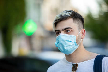 portrait of man smoking an electronic cigarette outdoorの写真素材