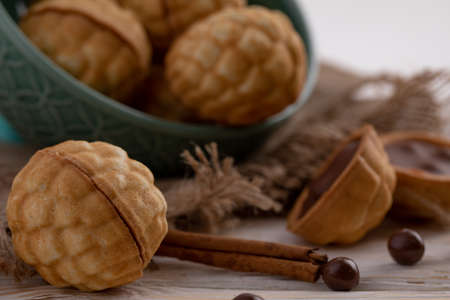delicious walnut shaped shortbread sandwich cookies filled with sweet condensed milk and cinnamon on...