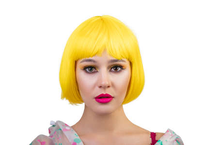 Hipster girl in in yellow wig isolated on white background. Close up portrait of cheerful woman...