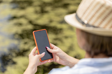 portrait of a woman smiling in the garden. copy spaceの写真素材