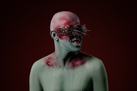 Demon man with spikes on the eyes. Halloween concept makeupの写真素材