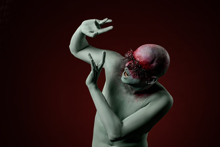 Demon man with spikes on the eyes. Halloween concept makeup