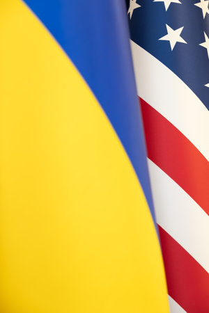 flags of Ukraine and the United States of America together. Symbol of America's support for Ukraine