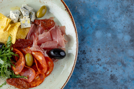 Antipasto. Meat platter, cheese, chips, prosciutto, sausage.