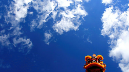 Lion Dance - Dragon & lion Dance Street Performances. Lion Head with blue skiesの素材