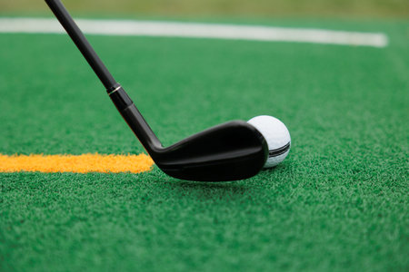 Golf balls on the golf course with golf clubs ready for golf in the first short. In the morning on...