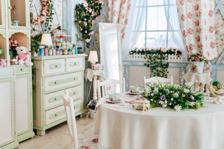 Elegant floral-themed dining room, vintage furniture, pastel green accents, floral arrangements on...
