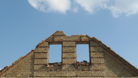 Belarusian village. The abandoned houses. The beaten-out glasses in windows. melancholyの写真素材