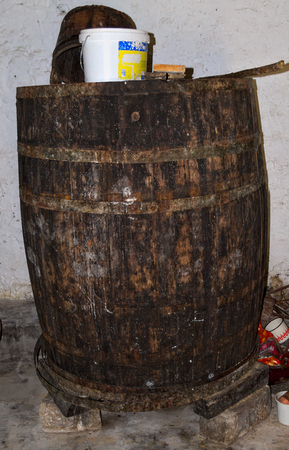 Old wooden wine barrel not in usage any moreのeditorial素材