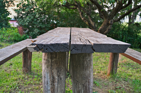 Wooden table in yard, close up