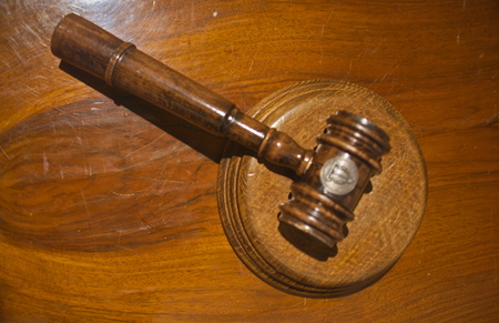Judge courtroom gavel on wooden table, closeupの写真素材