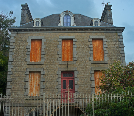 SOURDEVAL, FRANCE - April 6th 2019 - Big old stone houseのeditorial素材