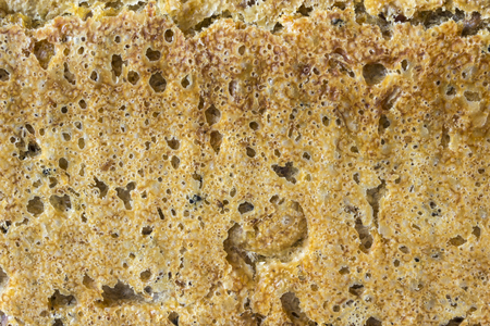 Homemade bread with cranberries and other additives. Polish cuisine. The brown crust of rye bread as a background for a web page.の写真素材