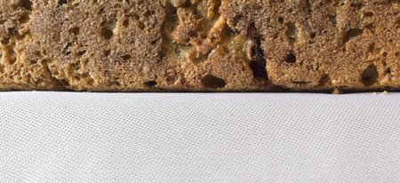 Homemade bread with cranberries and other additives. Polish cuisine. Rye bread on a gray napkin.