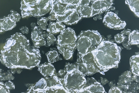 Ice floes floating on the river. Top view. Vistula River in Poland.の写真素材