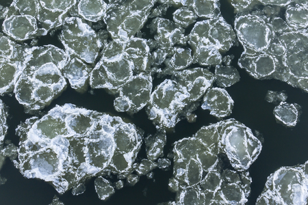 Ice floes floating on the river. Top view. Vistula River in Poland.の写真素材