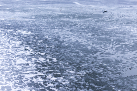 Melting ice on a lake. Thaw in January in Warsaw, Poland.の写真素材