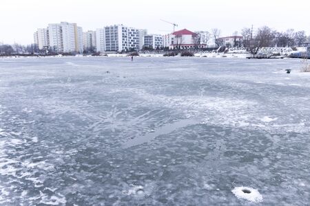 The wells in the ice to catch fish. Ice Fishing in Warsaw, Poland.の写真素材
