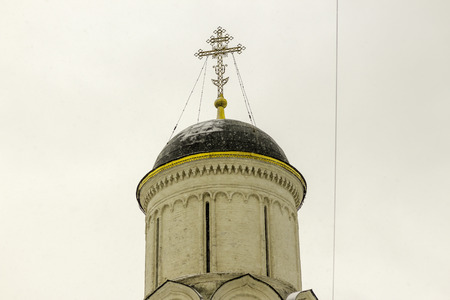 The dome of the Orthodox church during a snowfall. Architectural detail. A photo for the site about...