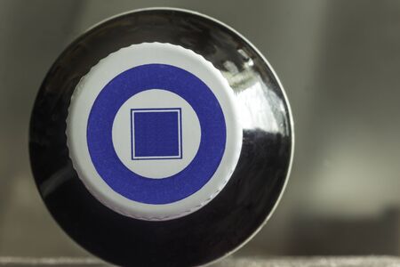 Macro photo of a dark bottle with medicine and a white lid. The bottle lies on its side. View from above. Site about medicine, health.の写真素材