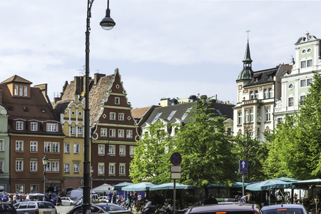 Refurbished buildings. Facades of buildings around the market square. Gothic and baroque details and...