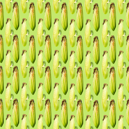 Raster vertical seamless pattern. Corn cobs on a green  background. Site about agriculture, farm, animal husbandry, graphics.の写真素材