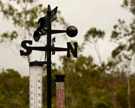 Weather Station wind vane temperature and rain gaugeの写真素材