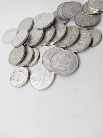 Collection of Indonesian rupiah coins on a white backgroundの写真素材