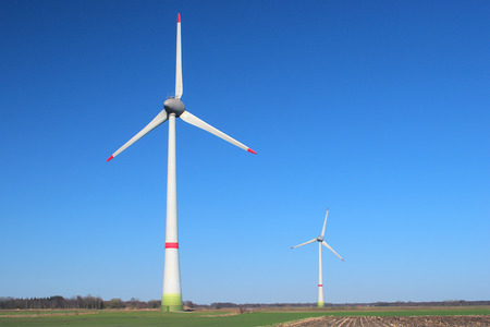 Two windmills on a cloudless, sunny day