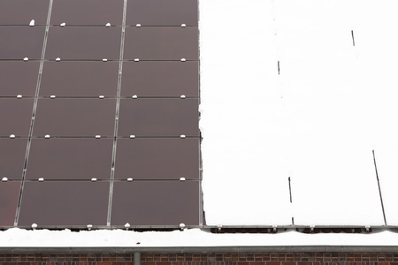 Cleaned solar panels and panels with snowの写真素材