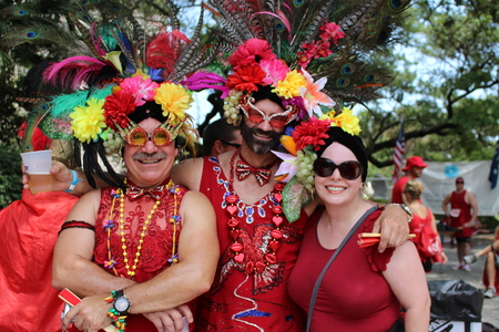 NEW ORLEANS, LOUISIANA, USA â AUGUST 7: Participants of the Red Dress Run at a party in Louis Armstrong Park after running down Bourbon Street in the French Quarter of New Orleans on August 7, 2015.のeditorial素材