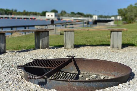 Camp fire pit beside a canal