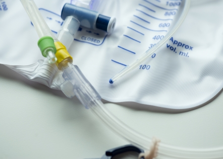 Close up photo of a urinary catheter with urine bag.の写真素材