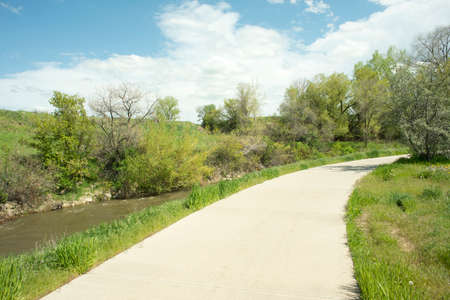 Bicycle and walking path along the Little Goose Creek in Sheridan, Wyoming.の写真素材