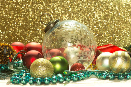 Antique clear cut glass Christmas ornament with lights, spruce, beads, and ribbon.の写真素材