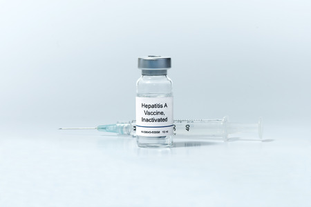 Hepatitis A vaccine in clear vial with syringe.の写真素材