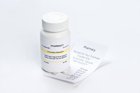 Prescription bottle and prescription on neutral background.の写真素材