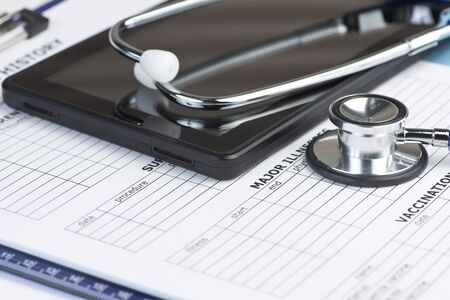 Personal computing device with stethoscope and patient medical record.の写真素材