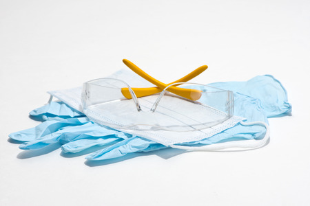 Gloves, mask and safety glasses for personal protection during medical procedures.の写真素材