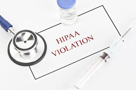 Hipaa regulations manual with patient documents.  All labels and/or documents are fictitious.  Names, serial numbers, and/or dates, are random and any resemblance to actual products is purely cooincidental.の写真素材