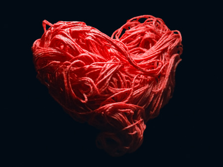 A card with a heart as a recognition of their tender love for a person on a bright holiday, on St. Valentine's Dayの写真素材