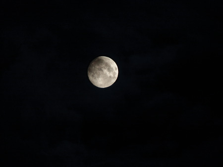 Moon, crescent, earth satellite against a dark background of black night sky.の写真素材