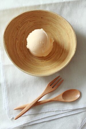 cantaloup sherbet ice cream with wooden spoon and forkの写真素材